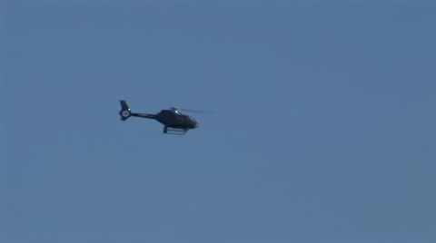 Helicopter flying on blue sky Stock Footage 45953684