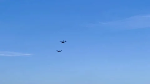 Helicopter flying in the blue sky Stock Footage 233465447