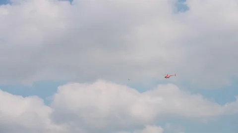 A helicopter is flying in the blue sky 库存影片 328370277