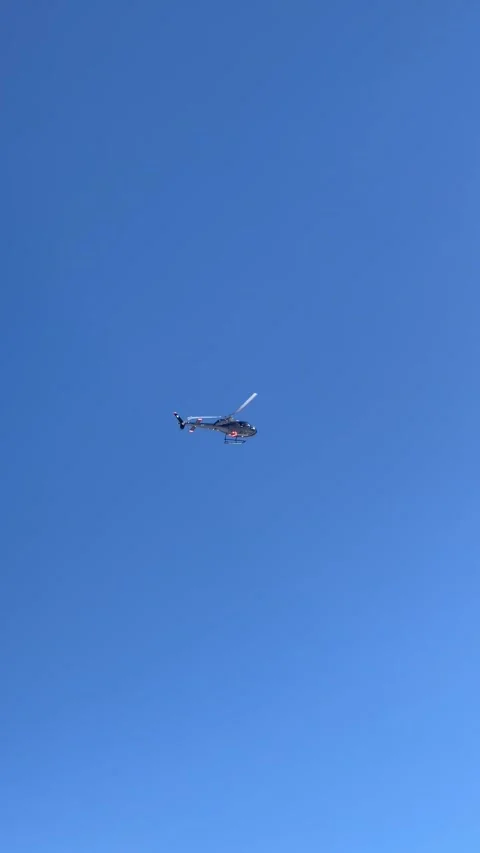 Helicopter flying in blue sky Stock Footage 337052193
