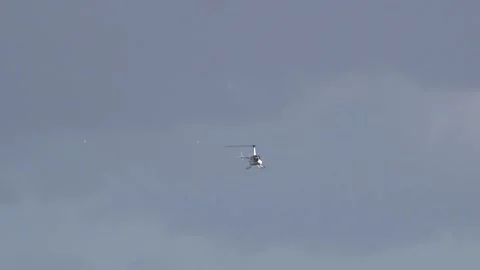 Helicopter flying to the camera - long distance shot Stock Footage 238031128