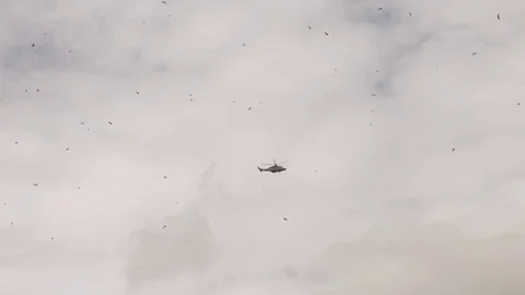 Helicopter flying with confetti 動画素材 78573333