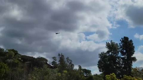Helicopter flying by Glendale, CA Stock Footage 236330601