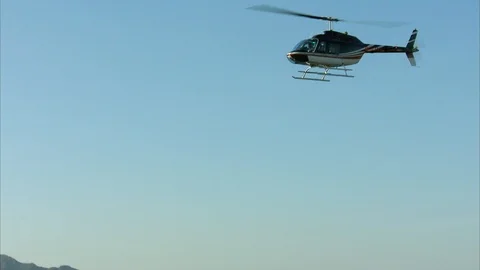 Helicopter flying high in the sky Stock-Footage 88374653