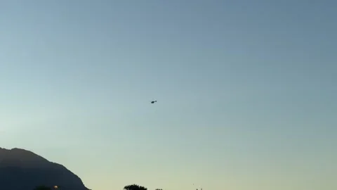 A helicopter flying high in the sky in suburban Cape Town, South Africa Vidéo 308995221