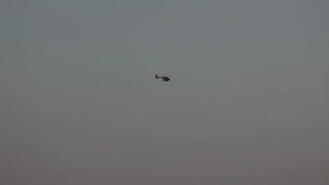 Helicopter flying with a kite in the grey sky Stock Footage 342738161