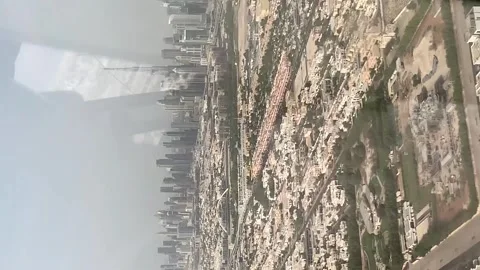 Helicopter flying over Dubai's plam Jumeirah beach Stock Footage 280735890