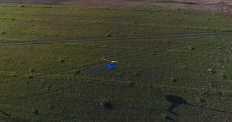 Helicopter Flying Over Field Stock Footage 318388652