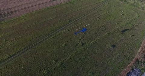 Helicopter Flying Over Field Stock Footage 318388657