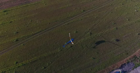 Helicopter Flying Over Field Stock Footage 318388658