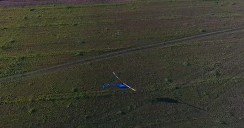 Helicopter Flying Over Field Stock Footage 318388668