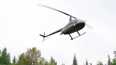 Helicopter flying over forest Stock Footage 61083964