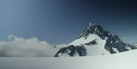Helicopter flying over glacier Stock Footage 64451845