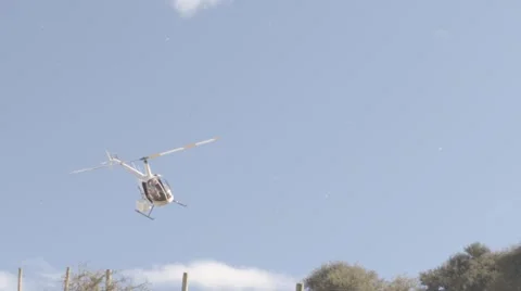Helicopter flying over landscape Stock Footage 65885972