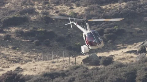 Helicopter flying over landscape Stock Footage 65885990