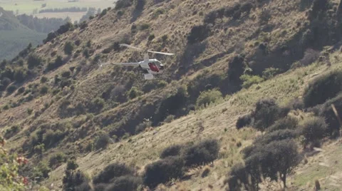 Helicopter flying over landscape Stock Footage 65885998