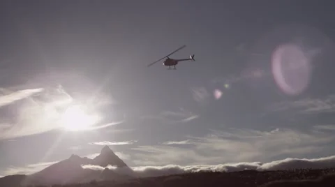 Helicopter flying over landscape Stock Footage 65886012