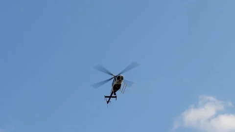 Helicopter flying over, with a mostly blue sky. Stock Footage 147459002