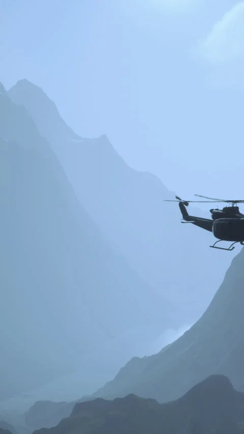 Helicopter flying over mountain range during daytime with clear skies Stock Footage 341989165