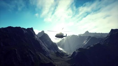 A helicopter is flying over a mountain range Ilustração Stock