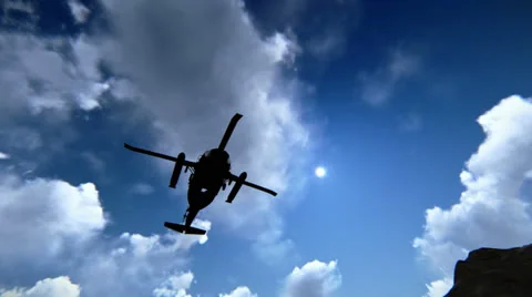 Helicopter flying over mountains Stock Footage 25302742