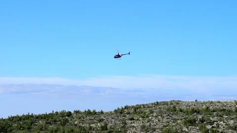 Helicopter flying over the mountains Stock Footage 135793032