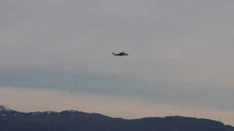 Helicopter Flying Over Mountains Stock Footage 305957038
