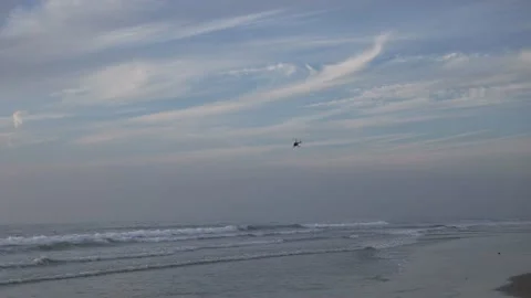 Helicopter flying over ocean Stock Footage 143807542