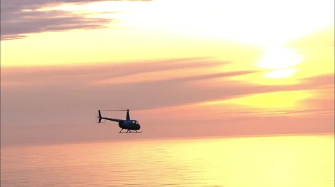 Helicopter Flying Over Ocean Sunset Aerial Stock Footage 56331353