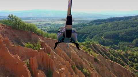Helicopter flying over red rocks Stock Footage 122342691