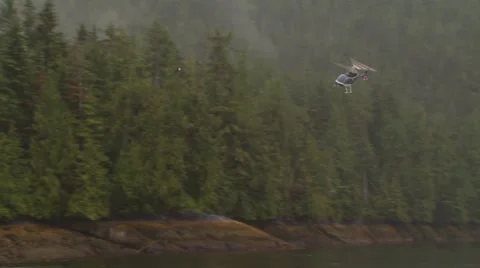 Helicopter flying over river Stock-Footage 54592297