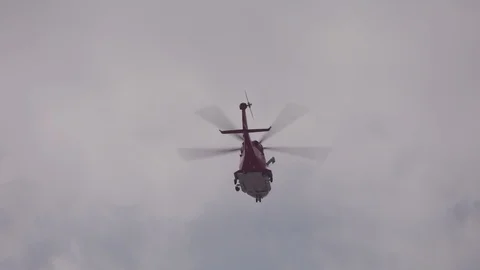Helicopter flying overhead Stock Footage