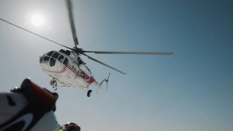 Helicopter Flying Overhead Remote Winter Expedition Backlit Descent Slow Motion Vidéo 331666291