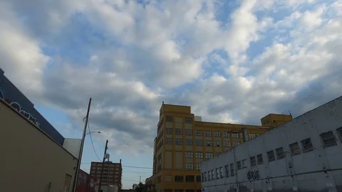 Helicopter Flying Overhead Through the Clouds in Urban Environment Stock Footage 92501096