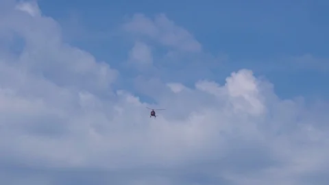 The helicopter is flying in the sky Stock Footage 94486143