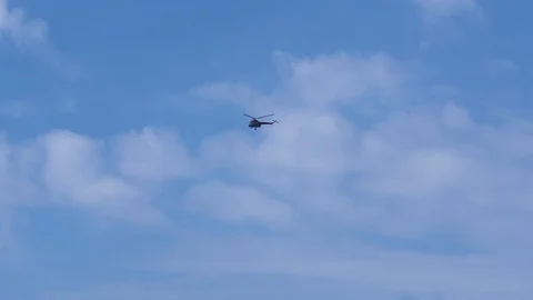 The helicopter is flying in the sky Stock Footage 94488411