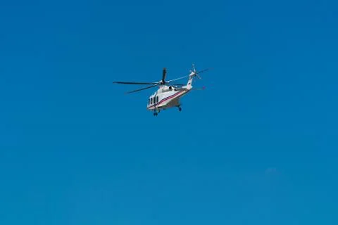 The helicopter is flying in the sky Stock Photos
