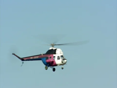 Helicopter flying in the sky video Stock Footage 86993621