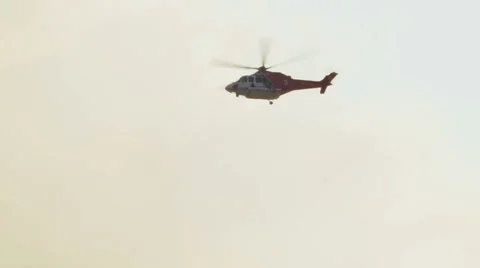 Helicopter flying into smoke Stock-Footage 54642442