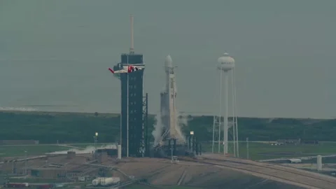 Helicopter flying by SpaceX Falcon Rocket carrying NASA's Psyche spacecraft Stock Footage 295929017