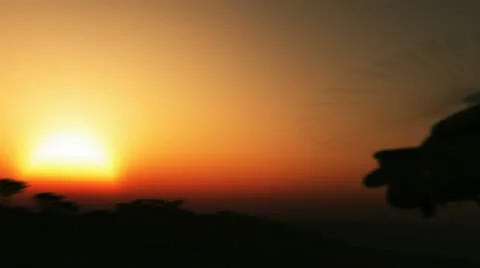 Helicopter flying into the sunset 24p Stock Footage 11689731