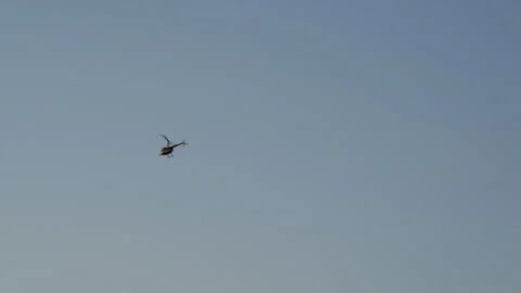 Helicopter flying in the sunset on the beach Stock Footage 267587002
