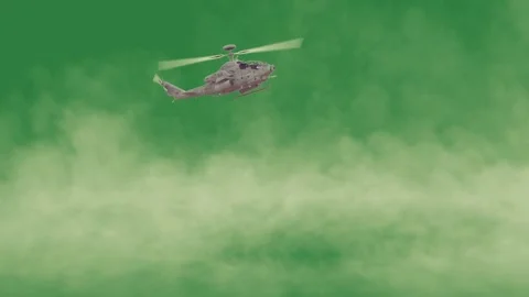 A helicopter flying through the air on green screen and cloudy sky in with Stock Footage 337340803