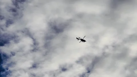 Helicopter flying through clouds slow motion 4K dramatic aerial aviation footage Stock Footage 320182539