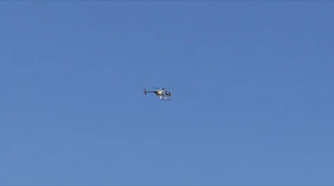Helicopter flying through kites Stock Footage 36790446