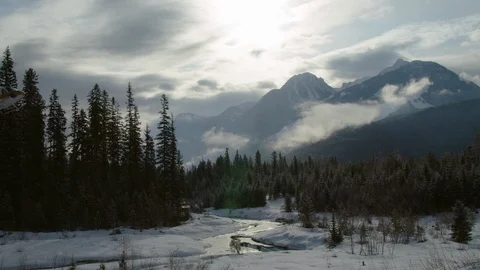 Helicopter flying through the valleys of snowy mountain Stock Footage 116788783