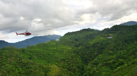 Helicopter formation over rain forest Video stock 25601478