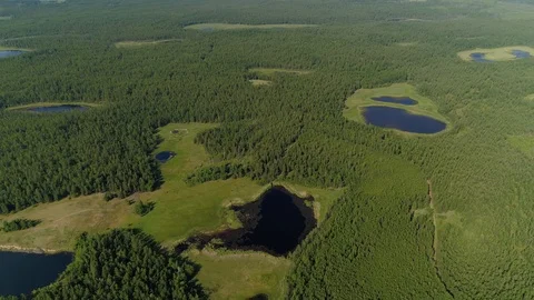 Helicopter glacial peat bogs swamp many lakes duckweed Yakutia Russia Ecology    Stock Footage 121239596