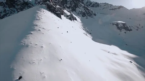 Helicopter going up to the snowy mountains Stock Footage 72169047