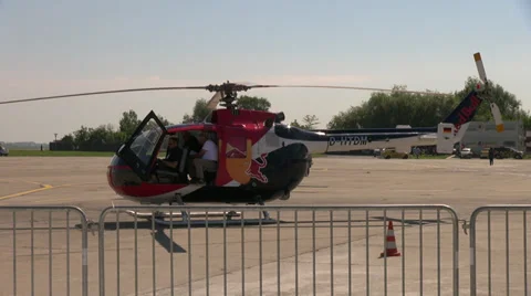 Helicopter on the ground, crew members preparing for flight, pilots Stock Footage 39750219